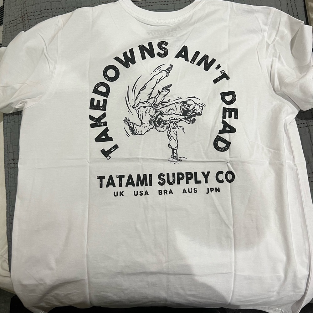 Tatami shirt. Bought large but definitely likes to be between medium and large.